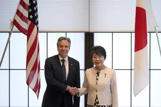 U.S. Secretary of State Antony Blinken, left, and Japanese Foreign Minister Yoko Kamikawa shake hands before their bilateral meeting at the Foreign Ministry's Iikura guesthouse in Tokyo, Sunday, July 28, 2024. (AP Photo/Hiro Komae)