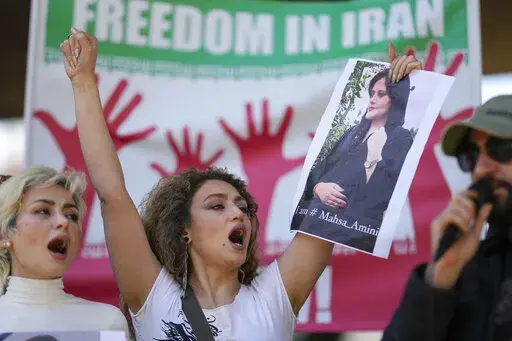 Iranians who live in Brazil protest against the death of Iranian woman Mahsa Amini, who died in Iran while in police custody, in Sao Paulo, Brazil, Friday, Sept. 23, 2022. As anti-government protests roil cities and towns in Iran for a fourth week, sparked by the death of a 22-year-old woman detained by Iran's morality police, tens of thousands of Iranians living abroad have marched on the streets of Europe, North America and beyond in support of what many believe to be a watershed moment for th