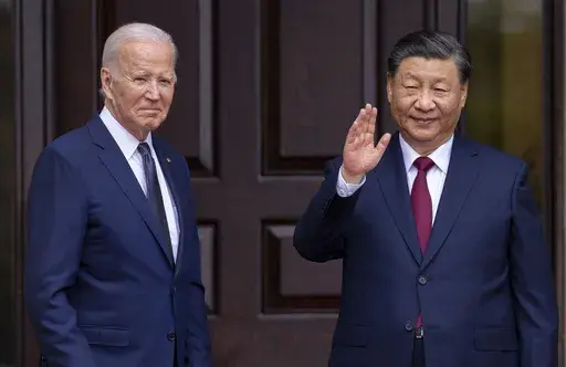 President Joe Biden, left, greets China's President President Xi Jinping in Woodside, Calif., Nov, 15, 2023. The United States sees Hong Kong's new national security law as a tool to potentially silence dissent both at home and abroad, but has tread carefully so far in responding, a disappointment to those fighting for democracy and freedoms in the Chinese territory. (Doug Mills/The New York Times via AP, Pool, File)