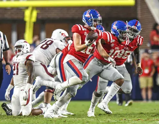 FILE -Mississippi linebacker Luke Knox (16) celebrates a fumble recovery against Arkansas during an NCAA college football game Saturday, Sept. 7, 2019, in Oxford, Miss.  Knox, who appeared in 23 games at Mississippi before joining Florida International, has died, the university said. Knox died Wednesday, Aug. 17, 2022, school officials said. The cause was not revealed, though the university said early Thursday that police “do not suspect foul play."(Bruce Newman/The Oxford Eagle via AP)