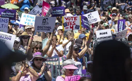 Abortion rights advocates hold a rally in support of the "Yes On 4" campaign in downtown Orlando, Fla., April 13, 2024. (Willie J. Allen Jr./Orlando Sentinel via AP, File)