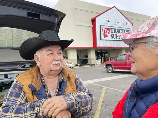 Larry Clark talks outside a supply store on Friday, Dec. 30, 2022, in Grand Junction, Colo. (AP Photo/Jesse Bedayn)