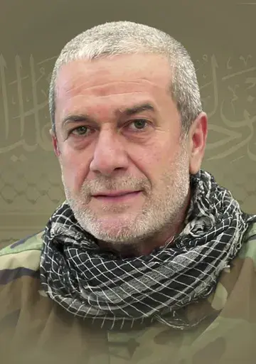 This picture released by Hezbollah media relations office, shows a portrait of Hezbollah commander Mohammad Naameh Nasser, who was killed by an Israeli airstrike that hit his car, in the southern costal town of Tyre, Lebanon, Wednesday, July 3, 2024. The strike took place as global diplomatic efforts have intensified in recent weeks to prevent escalating clashes between Hezbollah and the Israeli military from spiralling into an all-out war that could possibly lead to a direct confrontation betwe