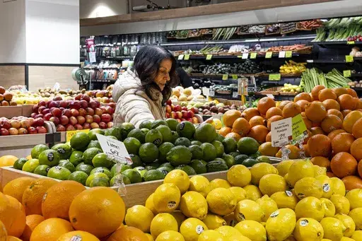 A woman browses produce for sale at a grocery store, Friday, Jan. 19, 2024, in New York. In final rule changes announced Tuesday, April 9, 2024, the federal program that helps millions of low-income mothers, babies and young kids will soon emphasize more fruits, vegetables and whole grains, as well as provide a wider choice of foods from different cultures. (AP Photo/Peter K. Afriyie, File)