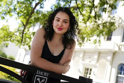 Helen Khuri poses for a portrait on the campus of Emory University Thursday, Oct. 6, 2022, in Atlanta. Khuri’s mother found a specialist to help her when the 19-year-old’s post-traumatic stress disorder flared up last spring. But the Emory University student had to temporarily move from Atlanta to Boston for treatment, even though she never set foot inside the hospital offering it. “It didn’t necessarily make sense to … kind of uproot my life, just to receive this three-week treatment 