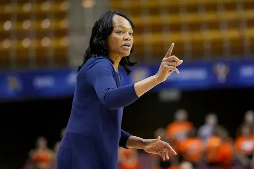 UNC Greensboro head coach Trina Patterson directs her team in the first half of a semifinal NCAA college basketball game for the Southern Conference tournament, March 6, 2020, in Asheville, N.C. (AP Photo/Kathy Kmonicek, File)