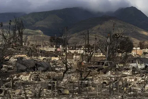 A general view shows the aftermath of a wildfire in Lahaina, Hawaii, Aug. 21, 2023. Hawaii’s electric utility acknowledged its power lines started a wildfire on Maui but faulted county firefighters for declaring the blaze contained and leaving the scene, only to have a second wildfire break out nearby and become the deadliest in the U.S. in more than a century. (AP Photo/Jae C. Hong, File)