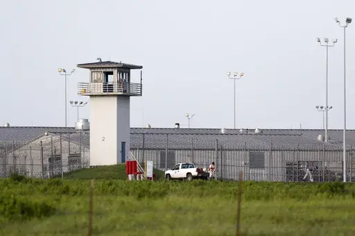 An inmate works outdoors during the hot summer outside a Texas prison unit in Huntsville, Texas, on June 25, 2015. (Rose Baca/The Dallas Morning News via AP, File)