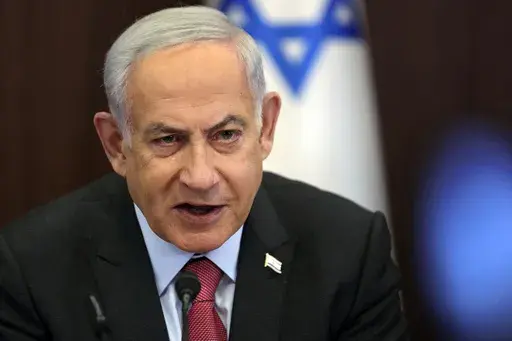 Israeli Prime Minister Benjamin Netanyahu attends a weekly cabinet meeting at the prime minister's office in Jerusalem on March 19, 2023. Netanyahu on Wednesday, March 29, rebuffed President Joe Biden's suggestion that the premier “walks away” from a contentious plan to overhaul the legal system, saying the country makes its own decisions. (Abir Sultan/Pool Photo via AP, File)