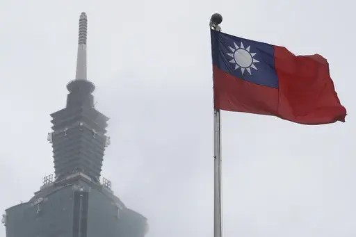 A Taiwan national flag flutters near the Taipei 101 building at the National Dr. Sun Yat-Sen Memorial Hall in Taipei, Taiwan, on May 7, 2023. Taiwan said Wednesday, Nov. 1, 2023 that China sent 43 military aircraft and seven ships near the self-ruled island, the latest sign that Beijing plans no let-up in its campaign of harassment, threats and intimidation. (AP Photo/Chiang Ying-ying, File)