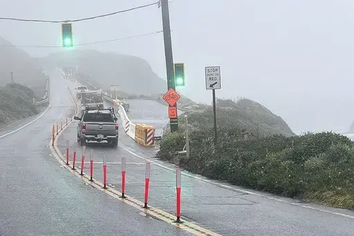 In this provided by the California Department of Transportation, a section of Highway 1 re-opened, Friday, May 17, 2024, in Big Sur, Calif., after repairs were made following storm damage. (Kevin Drabinski/California Department of Transportation via AP)