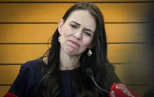 New Zealand Prime Minister Jacinda Ardern grimaces as she announces her resignation at a press conference in Napier, New Zealand Thursday, Jan. 19, 2023. Ardern says that she will not contest this year's general elections. (Warren Buckland/New Zealand Herald via AP)