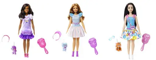 This combination of photos shows My First Barbie dolls, from left, Brooklyn, Teresa and Renee. My First Barbie, made specifically for children as young as 3, is 13.5 inches tall, with a broader waste that de-emphasizes the bust line, with flesh-tone modesty undergarments permanently attached. (Mattel via AP)