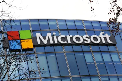 The Microsoft logo is pictured outside the headquarters in Paris, Jan. 8, 2021. A group of video game testers is forming Microsoft's first labor union in the U.S. and the largest in the video game industry. Communications Workers of America said Tuesday, Jan. 3, 2023, that about 300 quality assurance workers at Microsoft video game subsidiary ZeniMax Studios have voted to join the union. (AP Photo/Thibault Camus, File)