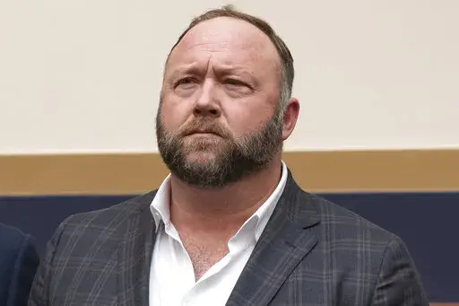 This Tuesday, Dec. 11, 2018, photo shows radio show host and conspiracy theorist Alex Jones at Capitol Hill in Washington. Jones was being questioned Wednesday, April 6, 2022, by lawyers for families of Sandy Hook Elementary School victims in Connecticut, where a judge had ordered the Infowars host to face mounting fines until he appeared for a deposition. (AP Photo/J. Scott Applewhite, File)
