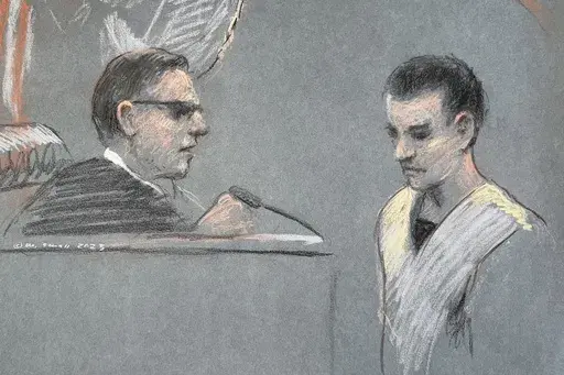This artist depiction shows Massachusetts Air National Guardsman Jack Teixeira, right, appearing in U.S. District Court in Boston, April 14, 2023. A federal judge has ordered the Massachusetts Air National Guard member accused of leaking highly classified military documents to remain behind bars while he awaits trial. In issuing his ruling Friday, May 19, U.S. Magistrate Judge David Hennessy said Jack Teixeira had breached his obligation to protect national security information belonging to the 