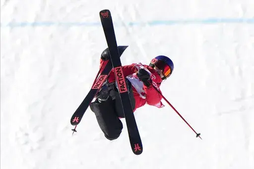 China's Eileen Gu competes during the women's slopestyle qualification at the 2022 Winter Olympics, Monday, Feb. 14, 2022, in Zhangjiakou, China. (AP Photo/Francisco Seco)