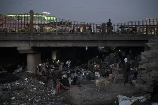 Afghans gather under a bridge to consume drugs, mostly heroin and methamphetamines in Kabul, Afghanistan, on Sept. 30, 2021. Afghanistan is the world’s fastest-growing maker of methamphetamine, a report from the United Nations drug agency said Sunday, Sept. 10, 2023. The country is also a major opium producer and heroin source, even though the Taliban declared a war on narcotics after they returned to power in August 2021.(AP Photo/Felipe Dana, File)