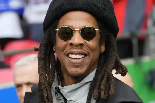 Jay-Z smiles ahead of the Champions League final soccer match between Borussia Dortmund and Real Madrid at Wembley stadium in London, Saturday, June 1, 2024. (AP Photo/Kirsty Wigglesworth, File)