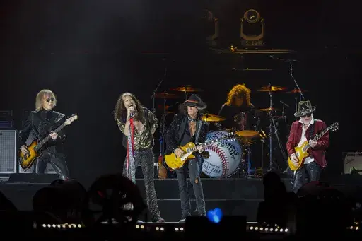 Tom Hamilton, from left, Steven Tyler, Joe Perry, John Douglas and Brad Whitford of Aerosmith, perform on Sept. 8, 2022, at Fenway Park in Boston. Aerosmith will be touring a city near you for the last time to celebrate their 50-plus years of being together. The Rock & Roll Hall of Fame band announced Monday, May 1, 2023 the dates for their farewell tour called “Peace Out” starting Sept. 2 in Philadelphia. (Photo by Winslow Townson/Invision/AP, file)