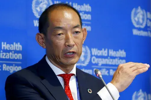 FILE – World Health Organization Regional Director for Western Pacific Takeshi Kasai addresses the media at the start of the five-day annual session Monday, Oct. 7, 2019, in Manila, Philippines. Current and former staffers have accused Kasai of racist, unethical and abusive behavior that has undermined the U.N. health agency’s efforts to curb the coronavirus pandemic. The allegations were laid out in an internal complaint filed in October 2021 and an email in January 2022 sent by unidentifie
