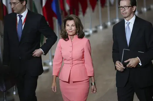 Austria's Chancellor Brigitte Bierlein, center, arrives for an EU summit at the Europa building in Brussels, Thursday, Oct. 17, 2019. Brigitte Bierlein, a former head of Austria’s Constitutional Court who became the country’s first female chancellor in an interim government after the previous administration collapsed in a scandal in 2019, has died. (AP Photo/Francisco Seco, File)