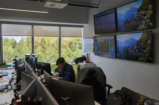 A worker sits inside the control centre of the Digital Realty data center, in Dublin, Ireland, Thursday, Oct. 17, 2024. (AP Photo/Bram Janssen)