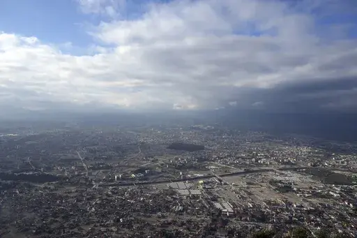 This Jan. 11, 2024 photo shows a view of the devastation in the quake-stricken city of Antakya, southern Turkey. A year after a powerful struck, many in the region are struggling to rebuild lives. (AP Photo/Khalil Hamra)