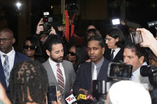 A$AP Rocky, center right, speaks next to attorney Chad Seigel after he was found not guilty in his trial Tuesday, Feb. 18, 2025, in Los Angeles. (AP Photo/Damian Dovarganes)