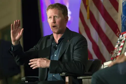 FILE -- Former Navy SEAL Robert O'Neill, who claims to have fatally shot Osama Bin Laden, talks about joining the service at the Richard Nixon Presidential Library and Museum in Yorba Linda, Calif., Wednesday, July 26, 2017. O'Neill has a small ownership stake in Armed Forces Brewing Company and has served as its brand ambassador. His recent social media complaint about a Navy sailor who performs as a drag queen and a police report alleging he used a racial slur are fueling efforts to stop the b