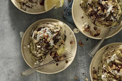 This mage released by Workman Publishing Group shows a recipe for grilled wedge salad with smoky ranch dressing from the cookbook "How to Grill Vegetables" by Steven Raichlen. (Steven Randazzo/Workman Publishing Group via AP)