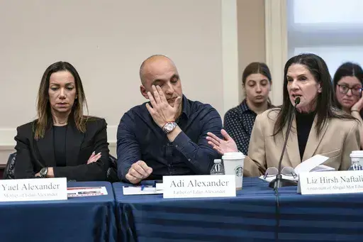 From left, Yael and Adi Alexander, parents of Eden Alexander, who was abducted and brought to Gaza on Oct. 7, 2023, listen to Liz Hirsh Naftali, great aunt of Abigail More Edan, as families and victims of the Hamas attacks meet with the House Foreign Affairs Committee, at the Capitol in Washington, Nov. 29. (AP Photo/J. Scott Applewhite, File)