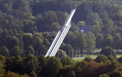 The Monument to the Liberators of Soviet Latvia and Riga from the German Fascist Invaders falls during its demolition in Riga, Latvia, Aug. 25, 2022. Russia's invasion of Ukraine has led to a renewed push to topple the last remaining monuments to the Soviet army that remained in Europe. At the end of the communist era, when Latvia, Lithuania and Estonia regained their independence from the Soviet Union, those countries began renaming streets and toppling statues of Lenin and other communist figu