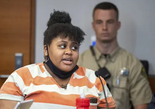 Pieper Lewis appears in Polk County court, Wednesday, May 31, 2023 in Des Moines, Iowa. Lewis was resentenced to probation for killing 37-year-old Zachary Brooks in June 2020. Lewis said that she was trafficked to Brooks against her will and sexually assaulted multiple times when she was 15. (Zach Boyden-Holmes/The Des Moines Register via AP)