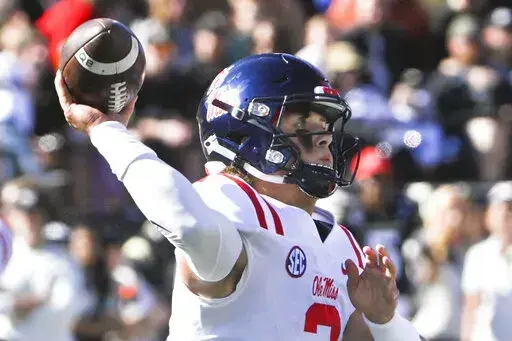 Mississippi quarterback Jaxson Dart (2) throws a pass during the first half of the team's NCAA college football game against Vanderbilt on Saturday, Oct. 8, 2022, in Nashville, Tenn. Mississippi won 52-28. (AP Photo/John Amis)