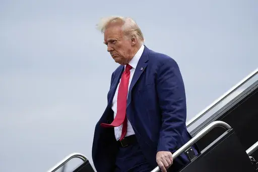 Former President Donald Trump arrives at Ronald Reagan Washington National Airport, Thursday, Aug. 3, 2023, in Arlington, Va., as he heads to Washington to face a judge on federal conspiracy charges alleging Trump conspired to subvert the 2020 election. The Associated Press reported on stories circulating online incorrectly claiming Trump is facing the death penalty on federal charges filed against him in Washington, D.C., on Tuesday related to his efforts to overturn the results of the 2020 ele