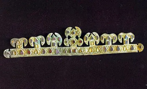 The 1,500 year-old golden tiara, inlaid with precious stones, one of the world's most valuable artifacts from the blood-letting rule of Attila the Hun, is seen in a museum in Melitopol, Ukraine, in November 2020. Russian troops stole and carted away the priceless crown and a hoard of other treasures after capturing the Ukrainian city of Melitopol in February. (AP Photo)