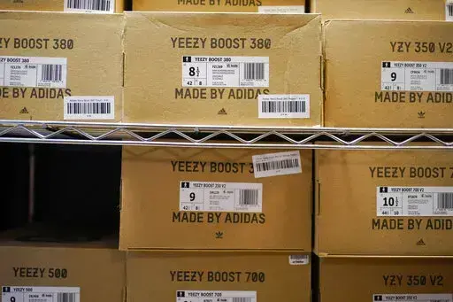 Boxes containing Yeezy shoes made by Adidas are seen at Laced Up, a sneaker resale store, in Paramus, N.J., Tuesday, Oct. 25, 2022. Adidas’ breakup with rapper Kanye West and the inability to sell his popular Yeezy line of shoes helped batter the company’s earnings at the end of last year. The German shoe and sportswear maker said Wednesday, March 8, 2023, that higher supply costs and slumping revenue in China also helped lead to a net loss of 513 million euros or $540 million in the fourth 