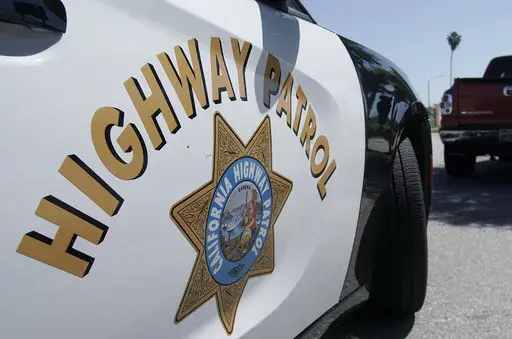 A California Highway Patrol officer stops a motorist in Anaheim, Calif., April 23, 2020. State authorities were investigating Monday, Nov. 20, 2023, after a California Highway Patrol officer shot and killed a man on a Los Angeles area freeway during a struggle over the weekend that was recorded on video. (AP Photo/Chris Carlson, File)