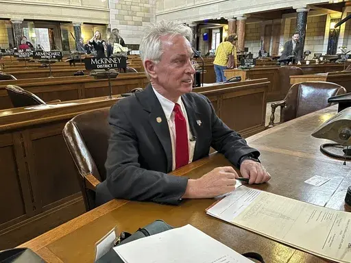 Nebraska state Sen. Loren Lippincott, of Central City, sits at his desk on the floor of the Nebraska State Capitol, Friday, Jan. 5, 2024 in Lincoln, Neb.. Lippincott has introduced a bill to add asphyxiation by nitrogen to the state's method of carrying out the death penalty. The measure comes even as Alabama officials await a judge's ruling on a request to block its plans to become the nation's first state to carry out an execution by nitrogen gas. (AP Photo/Margery Beck)