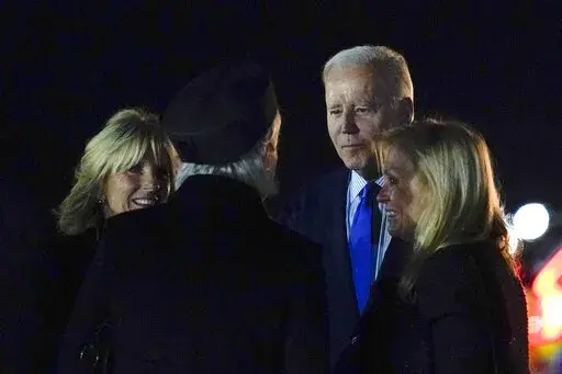 President Joe Biden and first lady Jill Biden arrive at London Stansted Airport, in Stansted, Britain, Saturday, Sept. 17, 2022. The Bidens are in London to attend the funeral for Queen Elizabeth II. (AP Photo/Susan Walsh)
