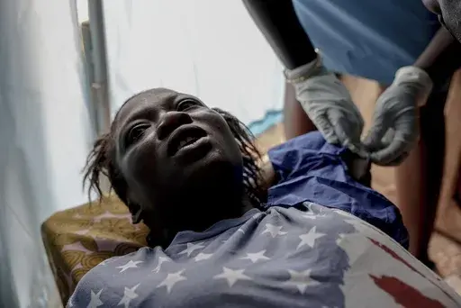 Mariama Soriba undergoes a procedure for a contraceptive implant at the Marie Stopes Sierra Leone Reproductive Choices clinic in Njagbahun, Sierra Leone, Saturday, March 5, 2025. (AP Photo/Caitlin Kelly)