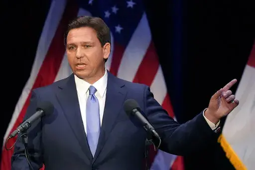Florida's Republican Gov. Ron DeSantis speaks during a debate against Democratic opponent Charlie Crist, at Sunrise Theatre in Fort Pierce, Fla., on Oct. 24, 2022. Presidential aspirants running for reelection to their current jobs while dreaming of the highest office in the land often face a dilemma during their campaigns. (AP Photo/Rebecca Blackwell)