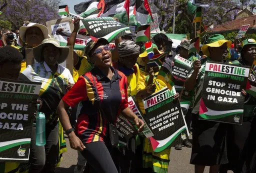 Pro-Palestinian supporters demonstrate at the entrance to the Israeli embassy in Pretoria, South Africa, on Oct. 20, 2023. South Africa's government has recalled Monday Nov. 6, 2023 its ambassador and diplomatic mission to Israel in condemnation of the bombardment of the Gaza Strip, calling it “a genocide”. (AP Photo/Denis Farrell, File)