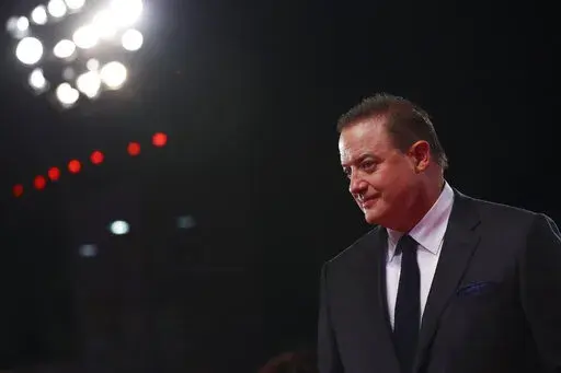 Brendan Fraser poses for photographers upon arrival at the premiere of the film 'The Whale' during the 79th edition of the Venice Film Festival in Venice, Italy, Sunday, Sept. 4, 2022. (Photo by Vianney Le Caer/Invision/AP)