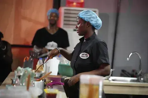 Chef Hilda Baci cooks to establish a new Guinness world record for the "longest cooking marathon", the 97-hour cook-a-thon, in Lagos, Nigeria, Thursday, May 11, 2023. A Nigerian chef on Monday continued her quest to set a new global record for the longest hours of nonstop cooking after surpassing the current record of 87 hours and 45 minutes. By 15:00 GMT on Monday, Hilda Baci had cooked for more than 97 hours, becoming a national sensation and to the cheering of many in Nigeria's commercial hub