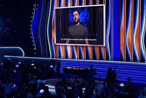 President of Ukraine, Volodymyr Zelenskyy, speaks on screen at the 64th Annual Grammy Awards on Sunday, April 3, 2022, in Las Vegas. (AP Photo/Chris Pizzello)