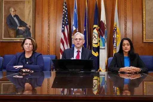 Attorney General Merrick Garland speaks at a news conference about the Justice Department's intervention to try to bring improvements to the beleaguered water system in Jackson, Miss., at the Justice Department in Washington, Wednesday, Nov. 30, 2022. At left is Deputy Attorney General Lisa Monaco and Associate Attorney General Vanita Gupta, right. (AP Photo/Patrick Semansky)
