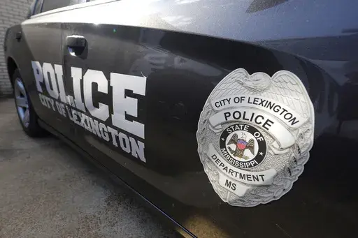 A Lexington, Miss., police cruiser is parked outside their facility near the town square, Monday, Aug. 15, 2022. (AP Photo/Rogelio V. Solis, File)