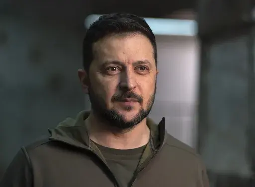 Ukrainian President Volodymyr Zelenskyy poses for a photo after his interview with The Associated Press in Kharkiv, Ukraine, Nov. 30, 2023. Zelenskyy will address U.S. military officers at the National Defense University as part of a last-minute push to convince Congress to provide more money for weapons before funding runs out. President Joe Biden has asked Congress for $61.4 billion for wartime funding for Ukraine as part of a $110 billion package that also includes money for Israel and other 